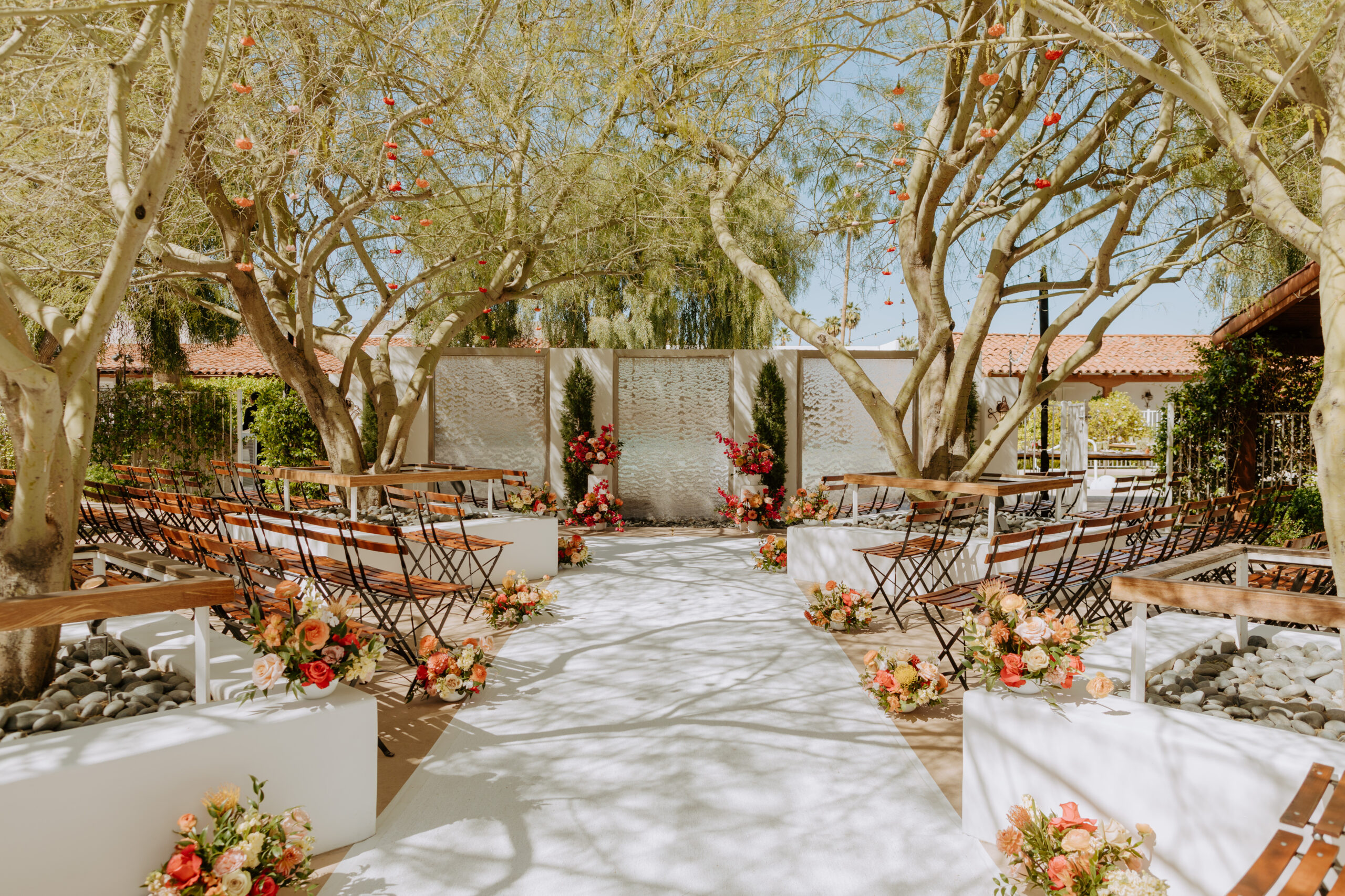 vibrant florals at a wedding ceremony in palm springs at a boutique hotel venue called Alcazar palm springs