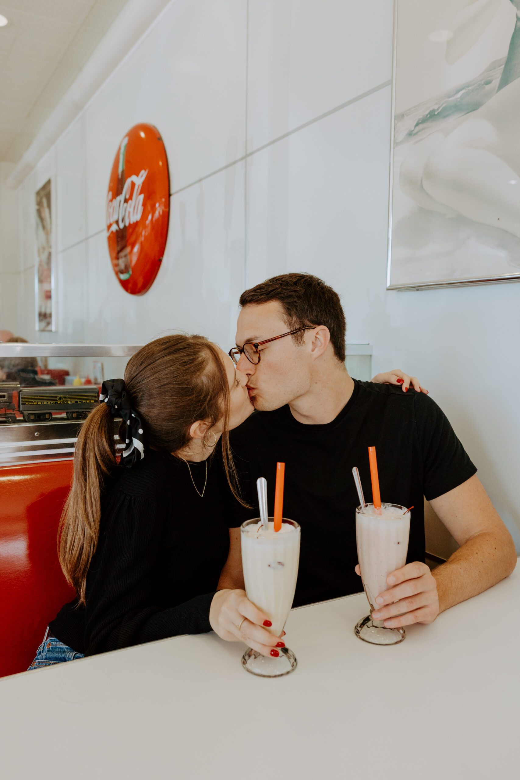 San Diego engagement photographer, Carlsbad engagement photos, Ruby’s Diner engagement session, unique engagement photo ideas, fun engagement session ideas, candid engagement photography, retro engagement photos, 50s themed engagement session, diner photoshoot, San Diego couples photographer, Carlsbad outlets photos, engagement session inspiration, non traditional engagement photos, playful engagement session, lifestyle engagement photography, engagement photo posing ideas, casual engagement photos, vintage inspired engagement, San Diego wedding photographer