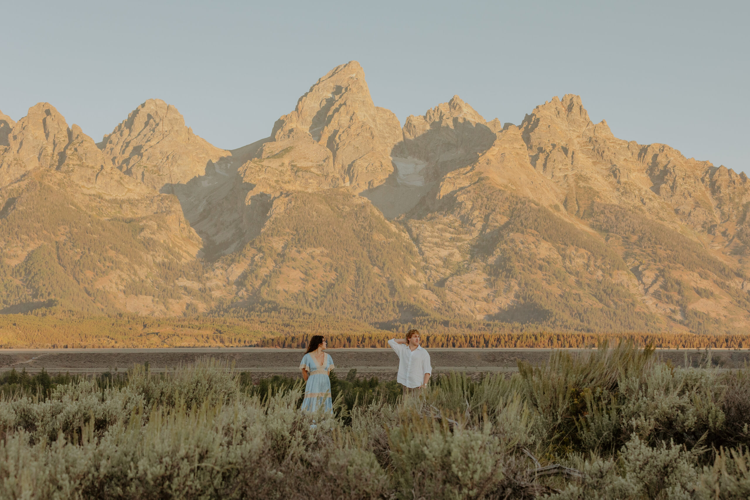 Grand Teton engagement photographer, Jackson Hole engagement photographer, Wyoming engagement photographer, Grand Teton engagement photos, Jackson Hole engagement photos, Grand Teton National Park photographer, Wyoming wedding photographer, Jackson Hole wedding photographer, Grand Teton wedding photographer, Grand Teton elopement photographer, Wyoming elopement photographer, adventure engagement photos, mountain engagement photos, sunrise engagement photos, Grand Teton couples photography